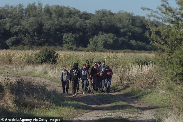 Migrants cross the Slovakia-Hungarian border near Vyskovce Nad Iplom, Slovakia on September 6, 2023