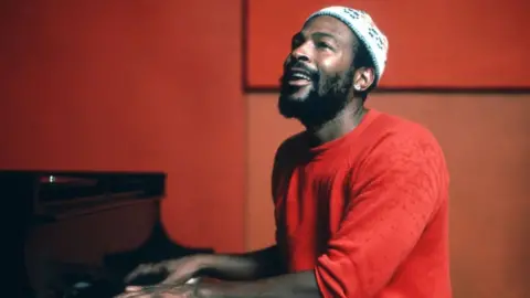 Getty Images Soul singer Marvin Gaye plays piano as he records in a studio in circa 1974