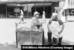 A national lottery salesman (left) chats with an ice-cream man in Sofia in 1975.