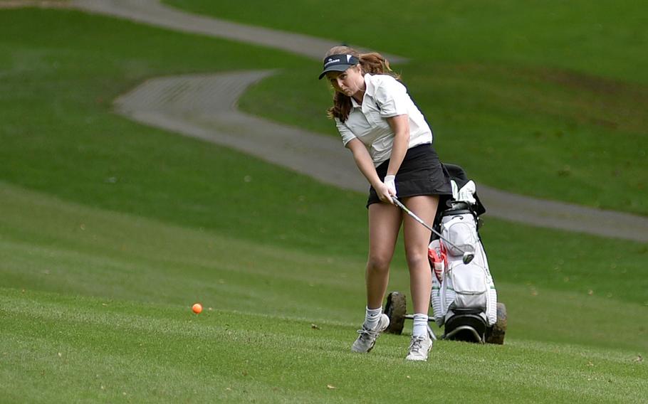 Isabelle Spencer slices the ball.