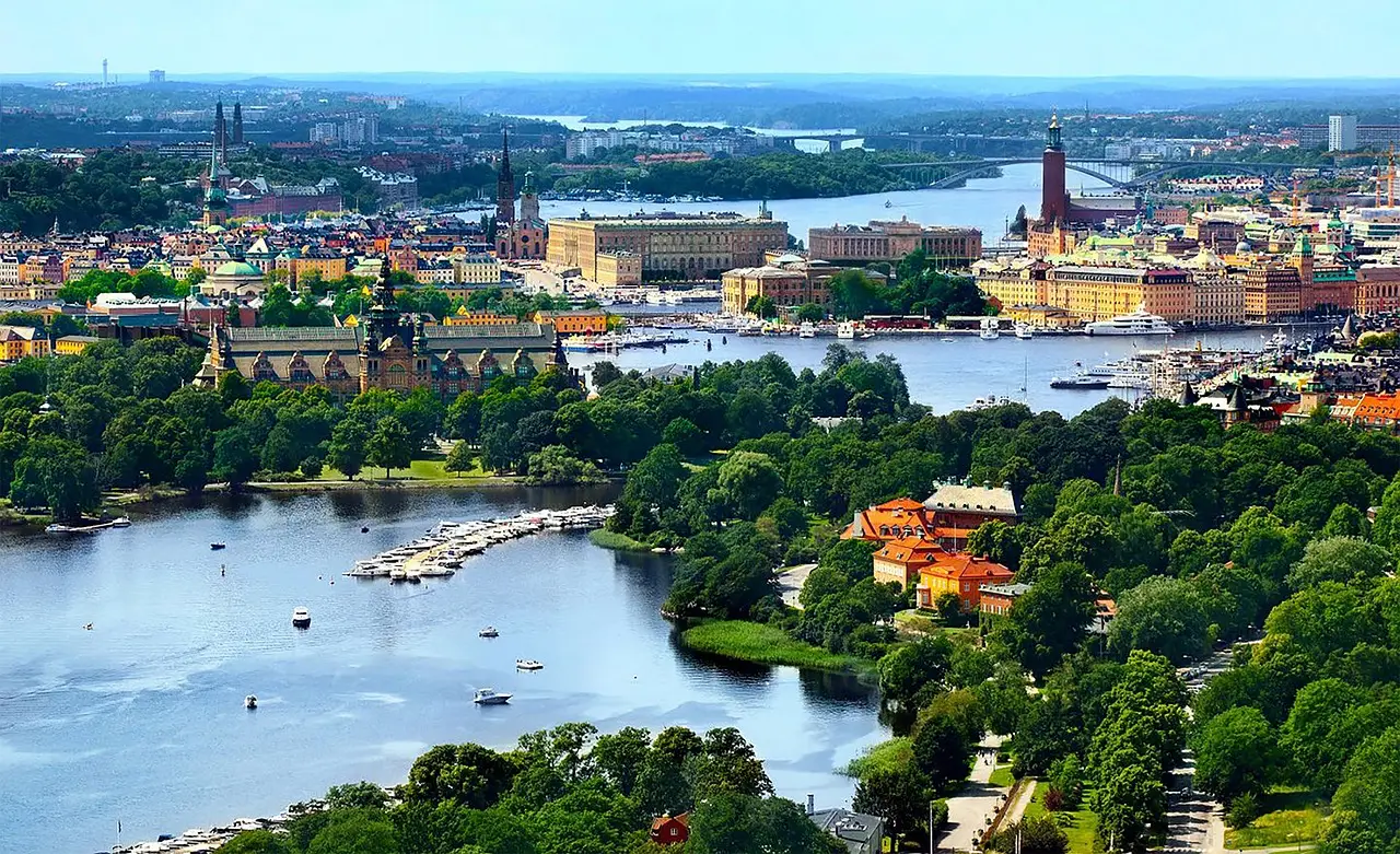 Aerial view of Stockholm, Sweden, showcasing the city’s historic buildings, waterways, and lush greenery.