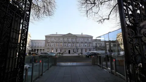 PA Media A photo of the Irish Parliament from its gates, during the day