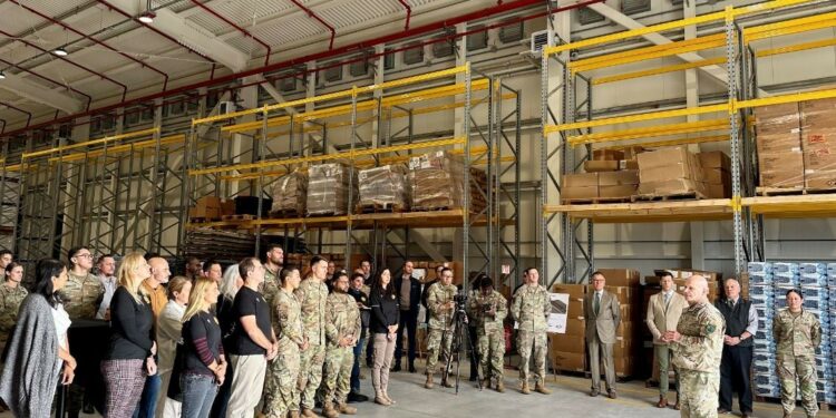 Soldiers, Airmen, U.S. and Italian civilian employees listen as U.S. Army Gen. Christopher Cavoli, commander, U.S. European Command & Supreme Allied Commander explains the importance of the new warehouse during an Oct. 9 event at Aviano Air Base. (Scavetta, Richard (Rick) A., CIV USARMY IMCOM EUROPE (US))