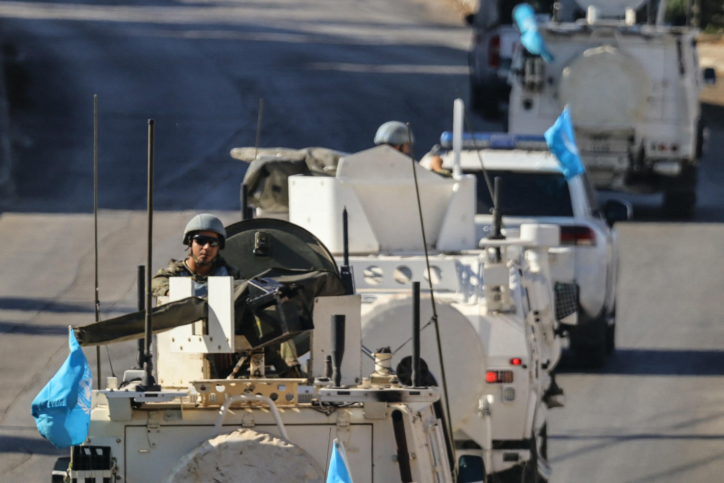 Vehicles from the United Nations Interim Force in Lebanon (UNIFIL) patrol in Marjayoun in southern Lebanon on October 12, 2024. UNIFIL, which says it has come under repeated fire in the Israeli-Hezbollah war in recent days, has patrolled the troubled border for decades.