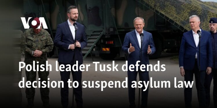 Polish leader Tusk defends decision to suspend asylum law