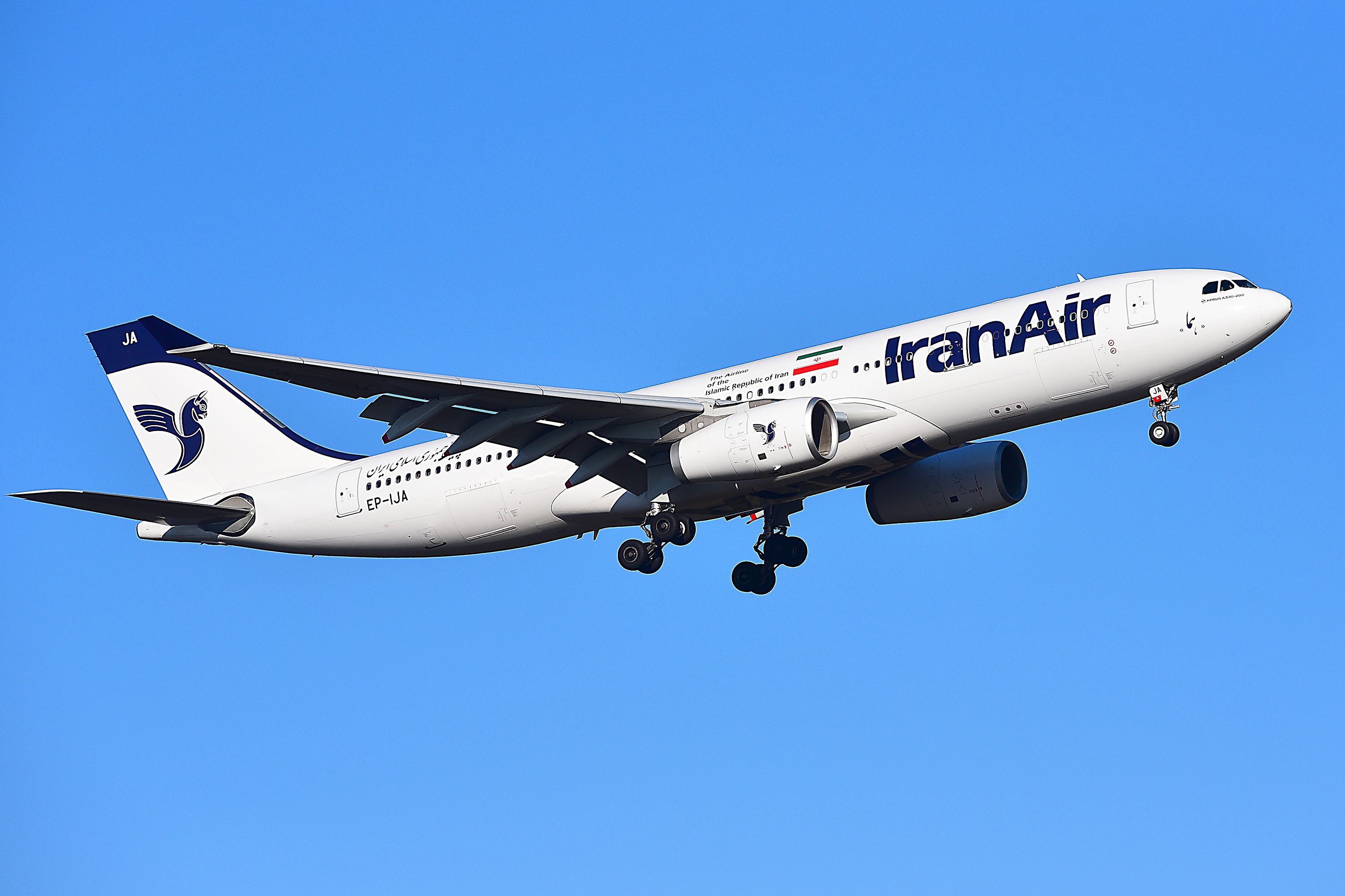 An Iran Air Airbus A330-200 flying in the sky.