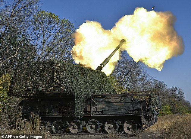 Ukrainian servicemen of the 26th artillery brigade fire an AHS Krab self-propelled howitzer toward Russian positions near the front line in the Chasiv Yar area