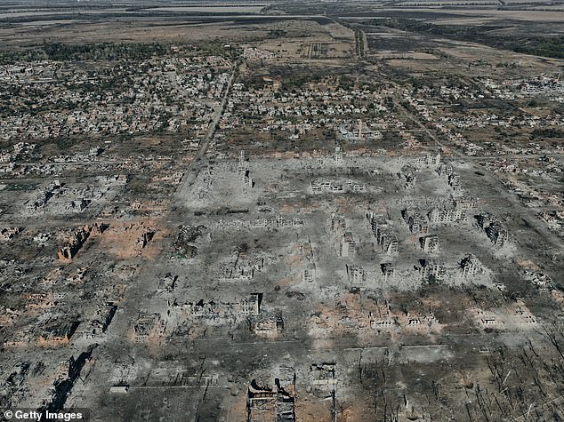 An aerial view shows the destroyed city of Vovchansk in the Kharkiv Region near the border with Russia, on October 2, 2024 in Vovchansk