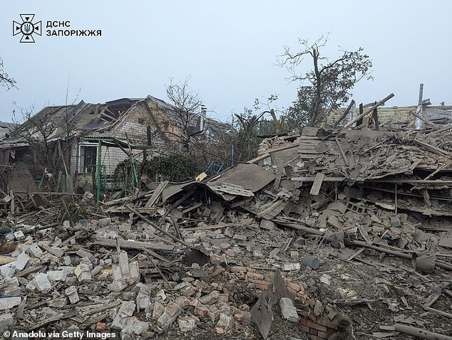 A view of the debris of residential area while search and rescue members conduct operation as they rescue residents from damaged houses after Russia carried out airstrikes on residential areas of Zaporizhzhia, Ukraine on October 10