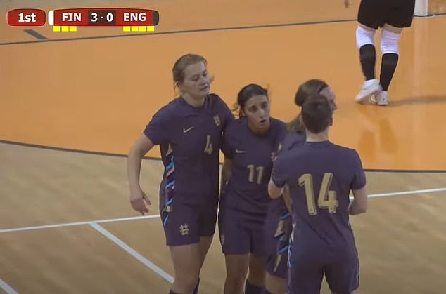 Her team-mates swarmed to celebrate with her, with England going onto lose the game 5-2