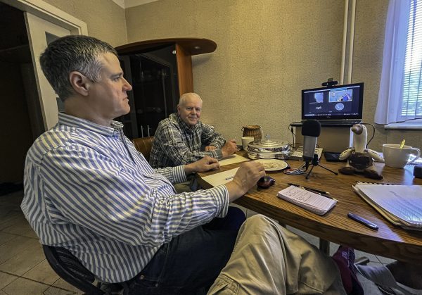 Viktor Barviks, left, and Ivars Landorfs worship on a Sunday morning in Riga, Latvia. 