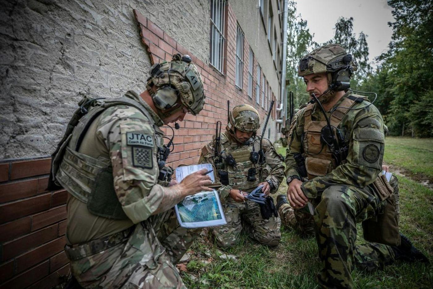 Czechia is actively involved in a collective defence system and contributes to developing the Alliance’s capacities. Czechia’s armed forces are involved in NATO activities aimed at both deterring enemy attacks and preparing and leading operations. Pictured: Czech Joint Tactical Attack Controller team during map orientation in exercise Ample Strike 2019.© NATO AIRCOM / Sarah Schulte
)