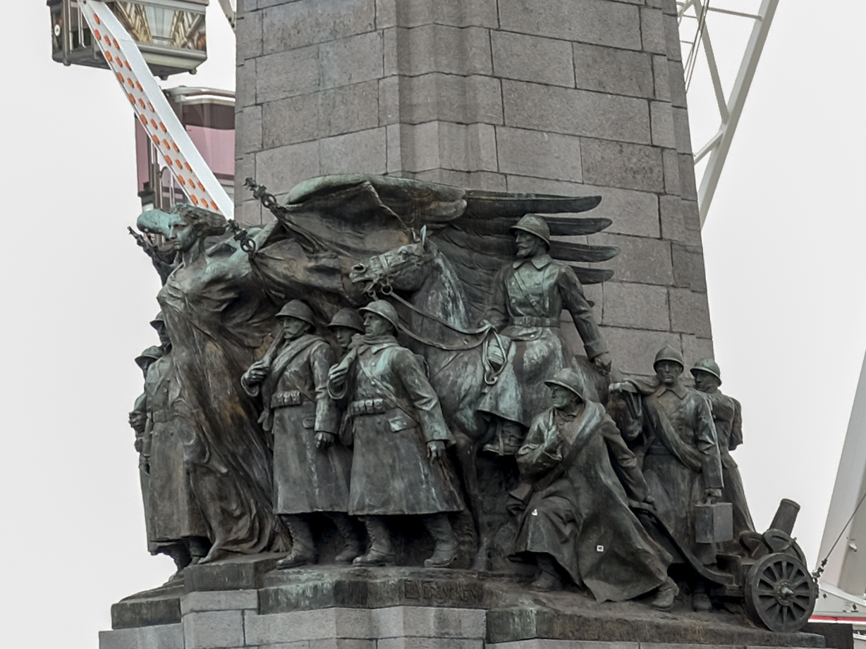 The Belgian Infantry Memorial rises in front of The View ferris wheel in Brussels. Photo by Mahvish S. Khan