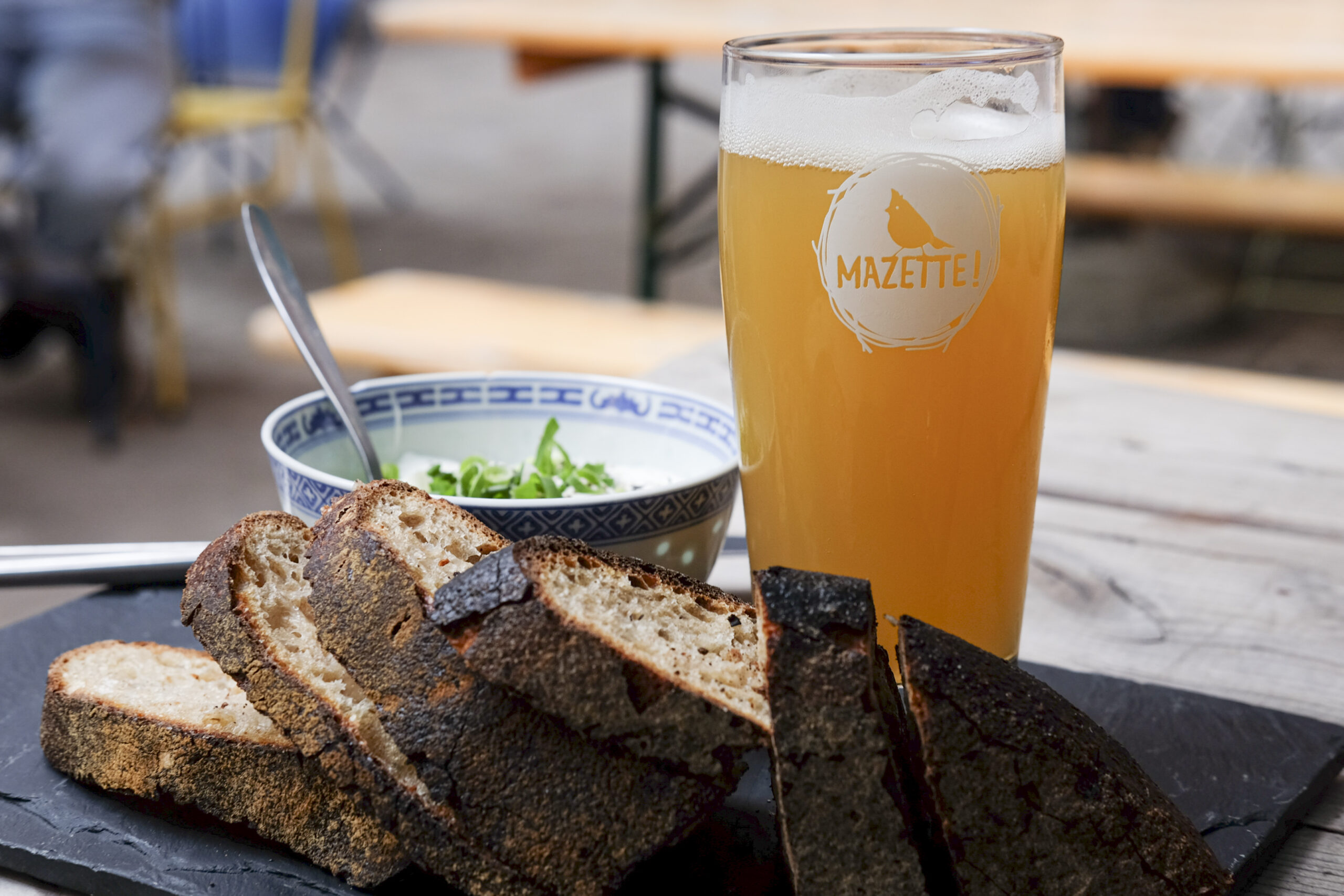 Locally made artisan bread and a yogurt spread accompany a glass of beer at a local brewpub in Brussels. Photo by Mahvish S. Khan