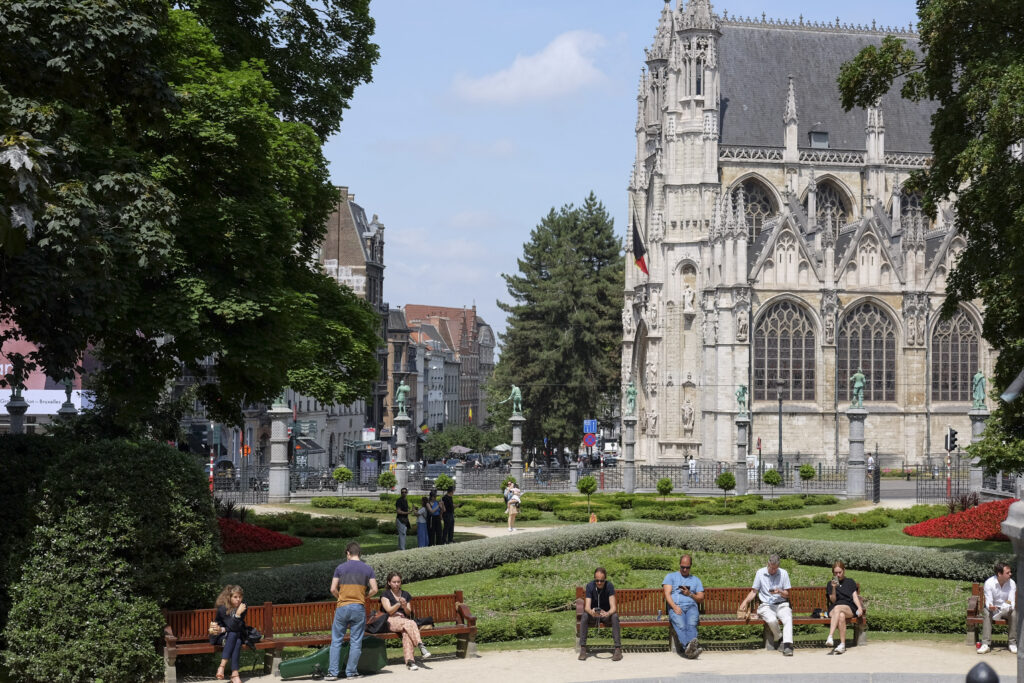 Park visitors enjoy the sun in the Place du Petit Sablon, with the Church of Our Lady of Victories behind them. Photo by Mahvish S. Khan