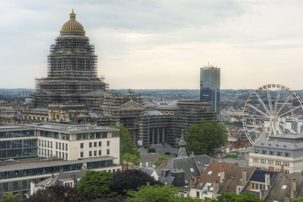 A view of Brussels shows the Palace of Justice (center), under renovation, and The View ferris wheel in June 2023. Photo by Mahvish S. Khan