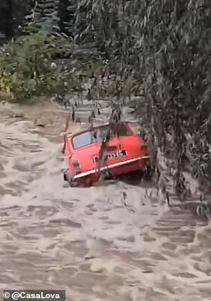 Footage shows the impact of the flood, with several cars partially submerged