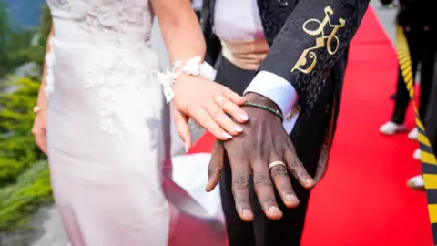 Reuters Norway's Princess Martha Louise and Durek Verrett show their wedding rings and an entwined 