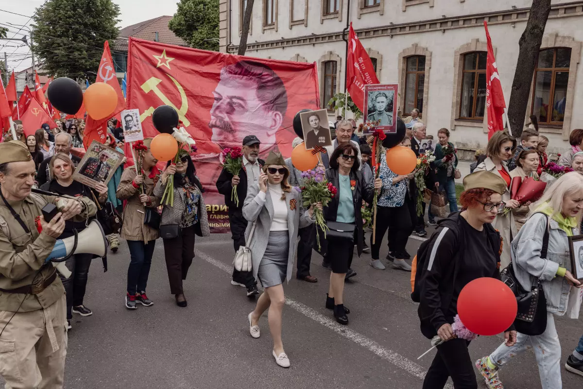 Marchers carried photographs of their ancestors and a banner featuring Josef Stalin on the Soviet flag during a Victory Day march of the Immortal Regiment, in Chișinău, Moldova, May 9.
