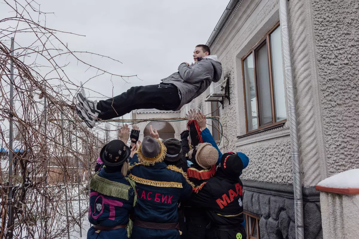 A boy is tossed into the air during the celebration of Malanka, a Ukrainian folk holiday with Christian-pagan roots, in Vălcineț, Ocnița district, Moldova, Jan. 13. Ukrainian is still widely spoken in Vălcineț.