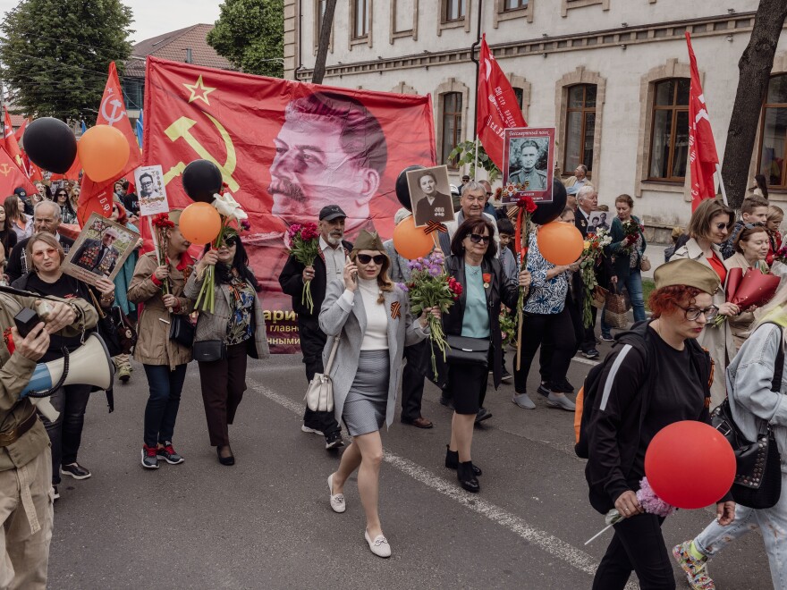 Marchers carried photographs of their ancestors and a banner featuring Josef Stalin on the Soviet flag during a Victory Day march of the Immortal Regiment, in Chișinău, Moldova, May 9.