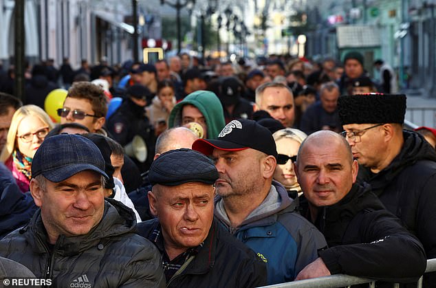 People queue outside a polling a station located in the embassy of Moldova, as the country holds a presidential election and a referendum on joining the European Union, in central Moscow, Russia October 20, 2024