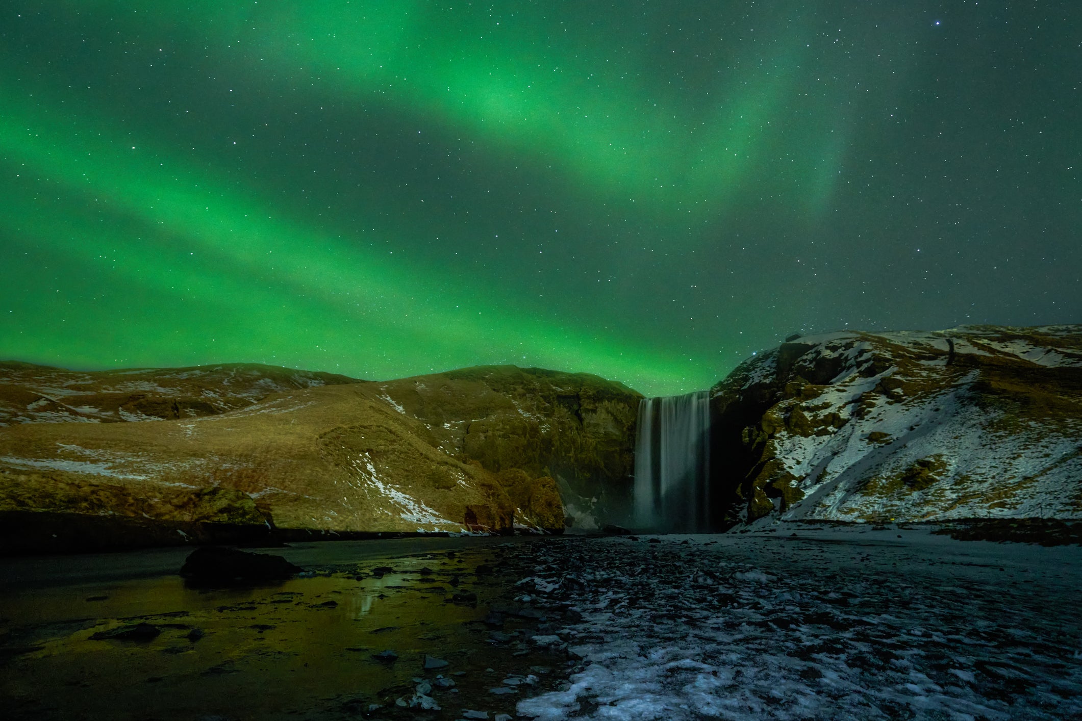 Northern Lights over Skógafoss waterfalls