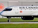 An Air Canada aircraft arrives at Montreal-Pierre Elliott Trudeau International Airport  in Montreal.