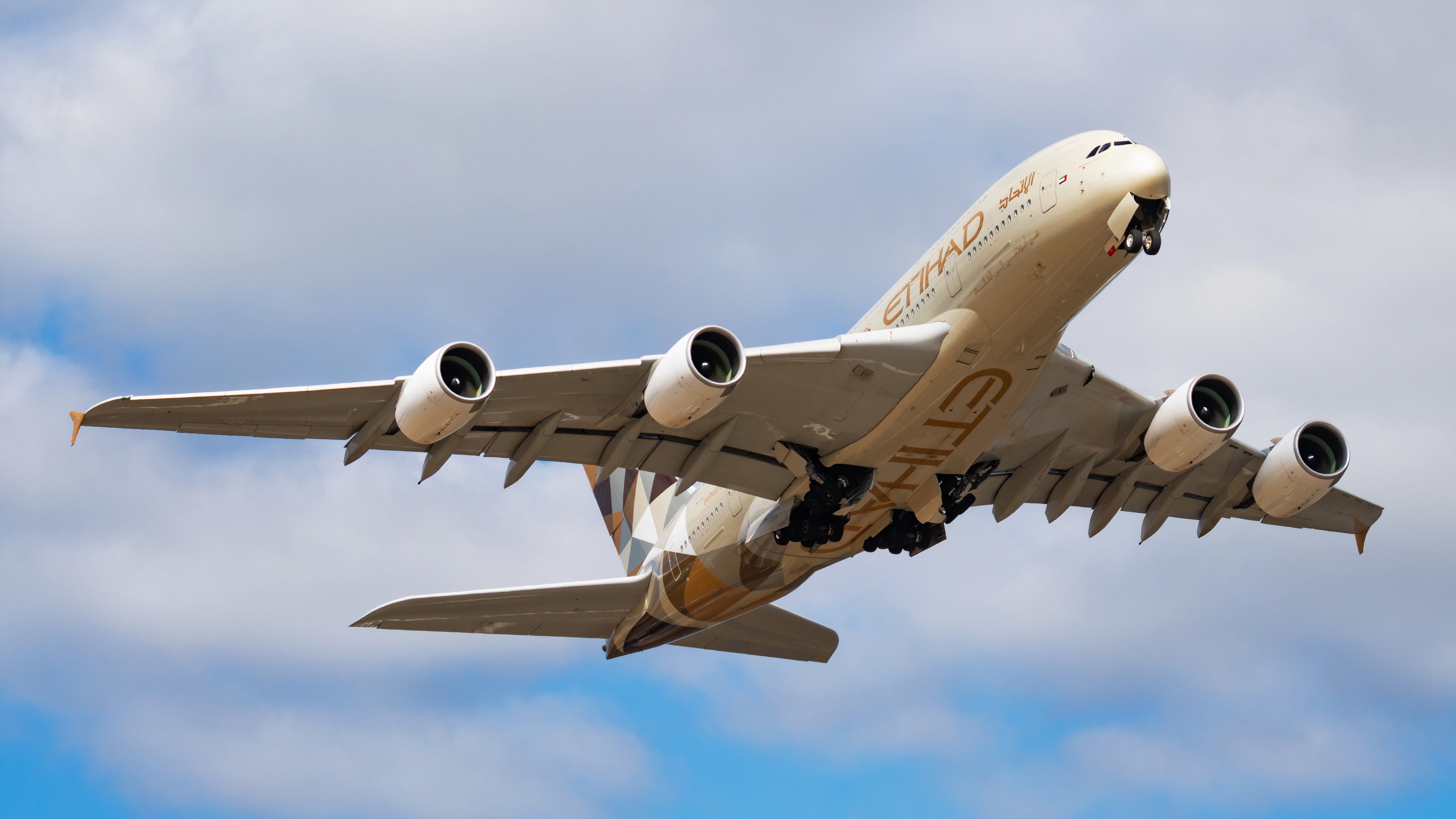 An Etihad Airbus A380 photographed from below on short finals.