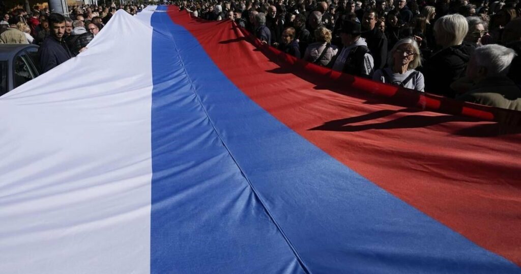 Serbia’s president talks with Putin and vows he’ll never impose sanctions on Russia