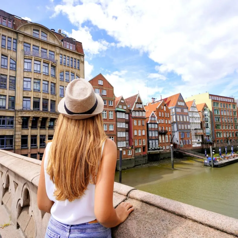 Tourist Admiring A Canal In Hamburg, Germany