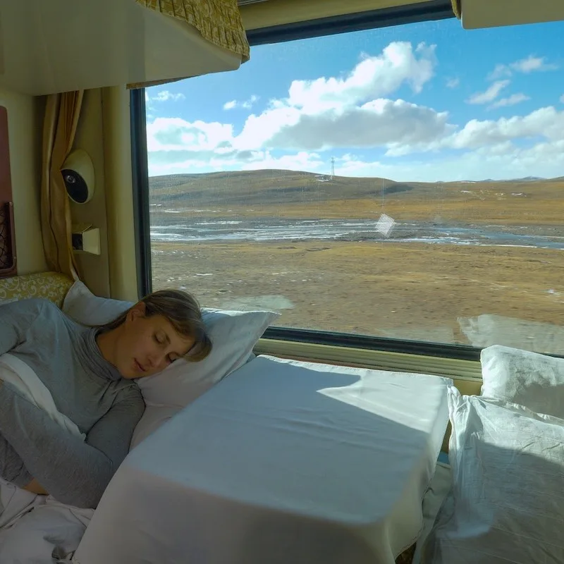Young Woman Sleeping In A Berth In A Sleeper Train