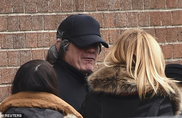 Gerry Hutch wears a disguise as he leaves after attending the funeral service for his brother Eddie Hutch, at the church of Our Lady of Lourdes in Dublin, Ireland February 19, 2016