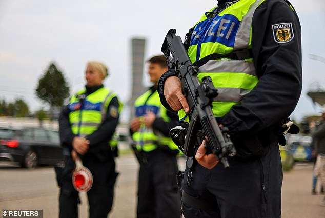 German police stand guard at a border with France, as all German land borders are subject to random controls to protect internal security and reduce irregular migration