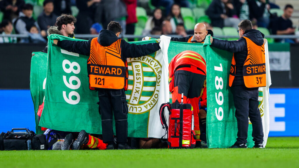 Medics rush to help and cover Nice star Sofiane Diop after terrifying injury in Europa League clash with Ferencvaros