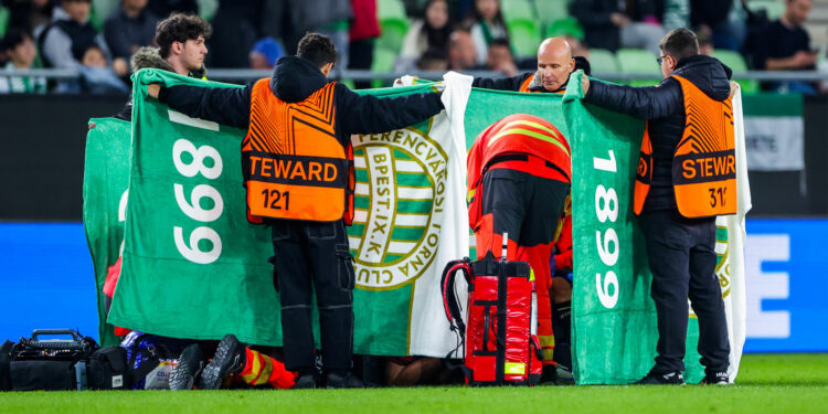 Medics rush to help and cover Nice star Sofiane Diop after terrifying injury in Europa League clash with Ferencvaros