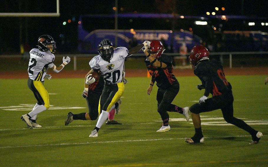 M.J. Watkins runs with the ball.