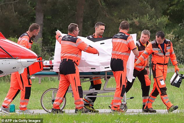 Picture taken on May 15, 2024 shows Slovak Prime Minister Robert Fico being transported from a helicopter by medics to the hospital in Banska Bystrica, Slovakia after he was shot multiple times