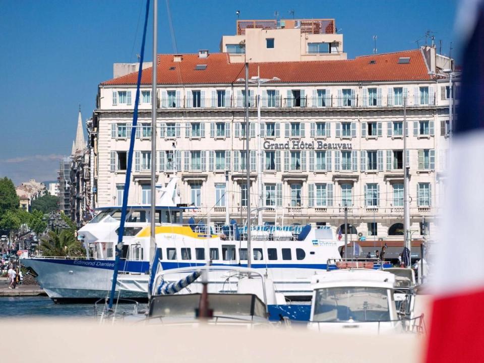 harbor view featuring boats and a hotel