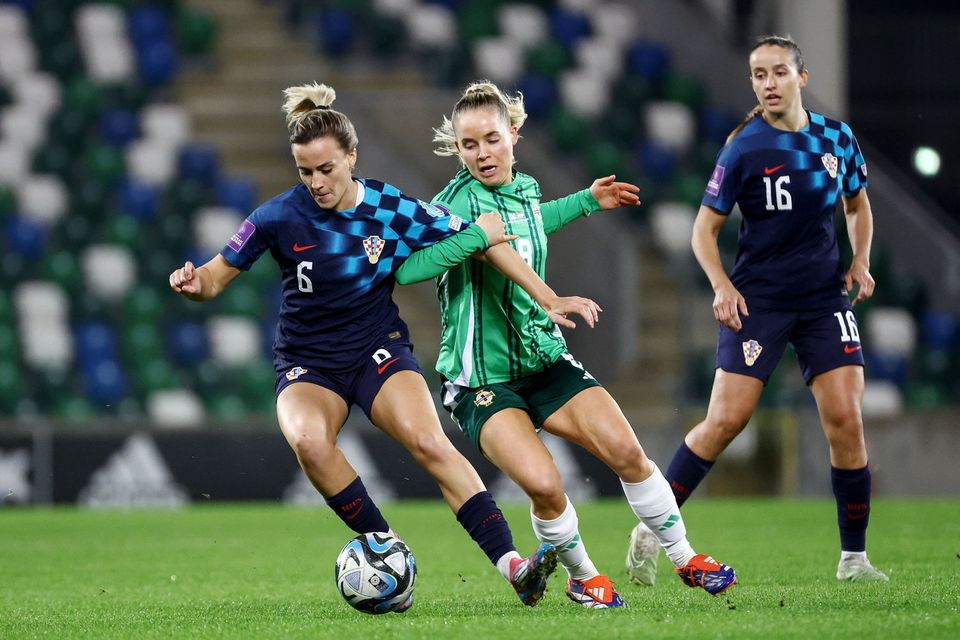 Northern Ireland's Connie Scofield tries to win possession back from Croatia's Bianca Galic