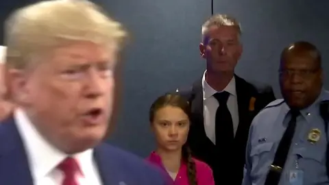 Reuters Greta Thunberg looks on as Donald Trump speaks