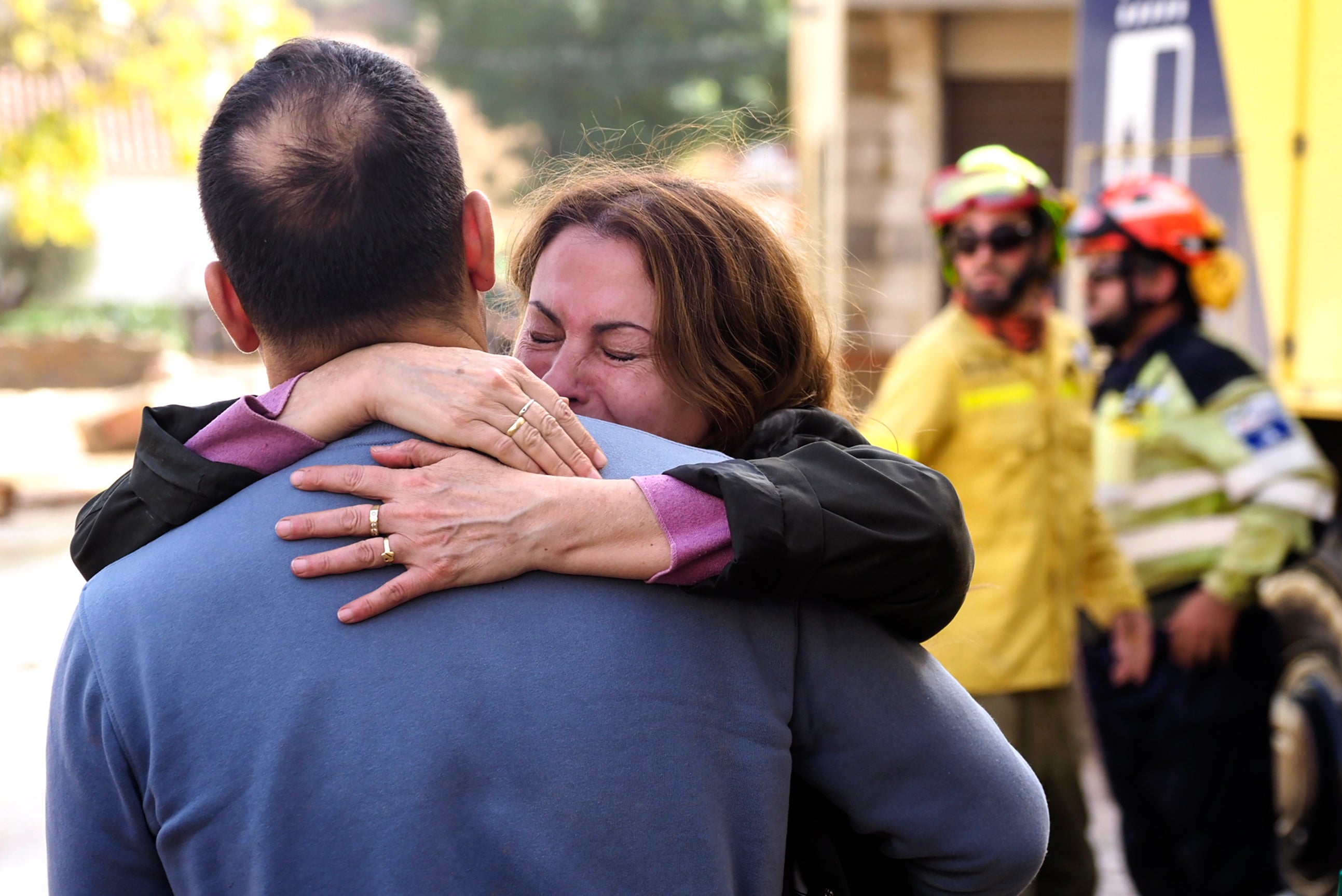 Residents react in the flood-hit municipality of Mira, in the province of Cuenca, Spain