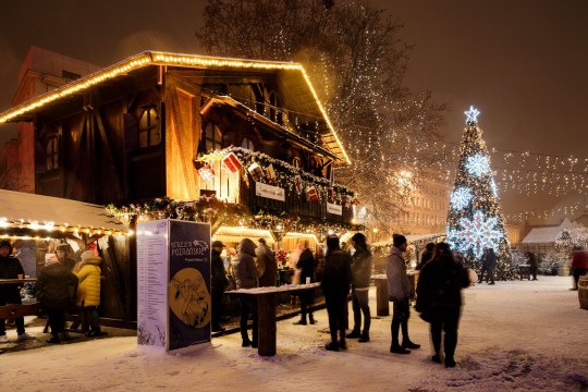 People at the Poznan Bethlehem Christmas market at Freedom Square in Poznan, Poland