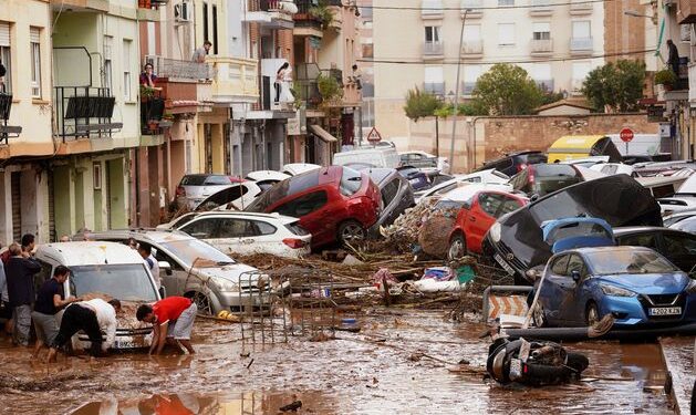 ‘The whole of Spain weeps with you’ – at least 95 dead as flash floods sweep Valencia