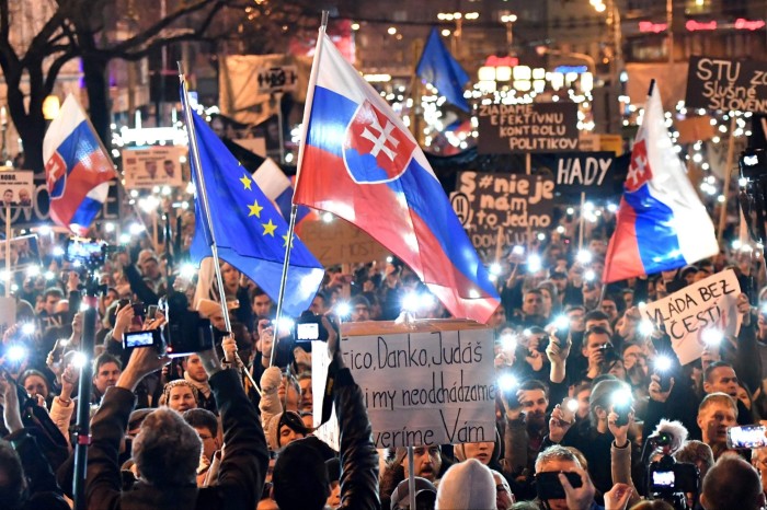 People take part in a rally near the Slovak National Uprising (SNP) square under the slogan ‘For a Decent Slovakia’, against corruption and to pay tribute to murdered Slovak journalist Jan Kuciak  