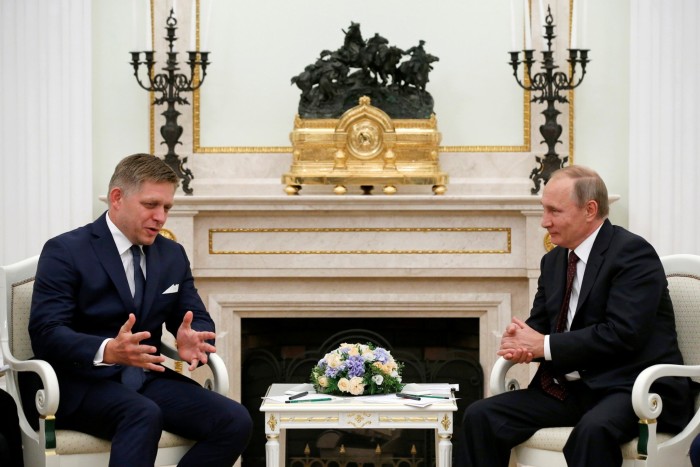 Slovak Prime Minister Robert Fico speaks with Russian President Vladimir 