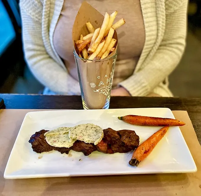 Steak that's a cut above! Paired with golden fries and vibrant veggies, this plate is a carnivore's dream come true.