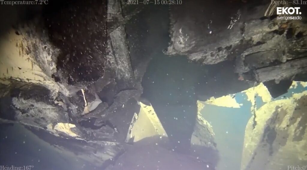 A footage, released by Swedish Radio, shows how pieces of MS Estonia’s steel structure are bent outwards from the hole in the ferry’s hull. Screenshot from the footage.