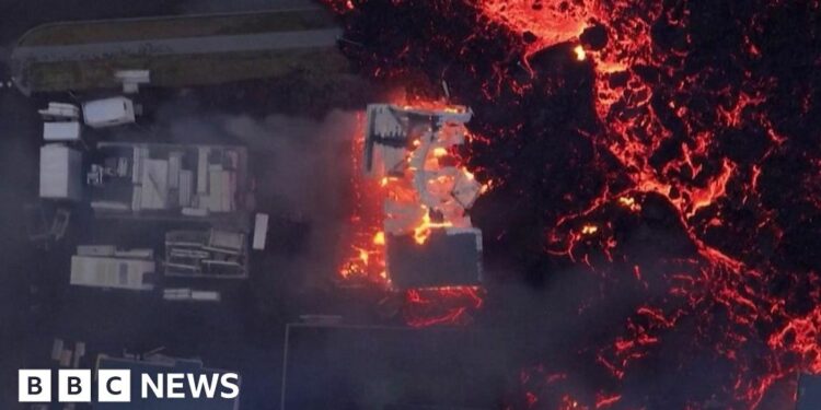 Aerial footage shows lava burning houses