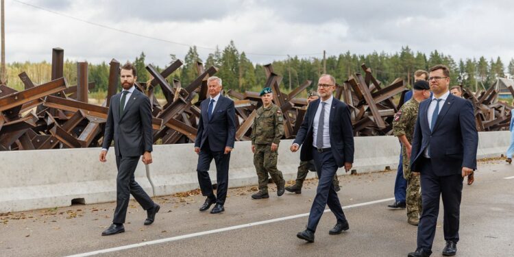 Baltic and Polish Defense Ministry officials at the Latvian border